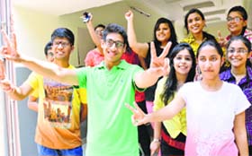 Non-medical stream topper in the city with 97.4% marks, Kartik Sahi (green T-shirt ) of Sacred Heart Convent School, Sarabha Nagar, celebrates his success with his friends