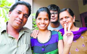 Babita of BCM Senior Secondary School, Basant City, who has bagged the first position in the city by securing 98.2% marks in the commerce stream, with her parents