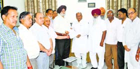 Congress and BJP councillors meet Mayor Harcharan Singh Gohalwaria in Ludhiana on Wednesday