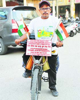 Bhausaheb Bhawar with his cycle in Ludhiana