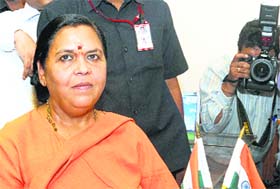 Water Resources Minister Uma Bharti takes charge at her office in New Delhi on Wednesday