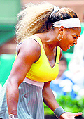 Serena Williams gestures after missing a return during her second round match against Spains Garbine Muguruza