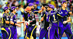 Kolkata Knight Riders greet each other after winning IPL play-off match against Kings Xi Punjab in Kolkata on Wednesday