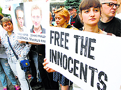 Activists protest in front of the presidential administration headquarters in Kiev on Wednesday