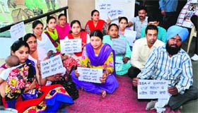 Inclusive education resource teachers protest outside the DEO office in Bathinda on Thursday