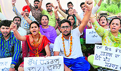 Members of the Inclusive Education Resource Teachers Union, Punjab, hold a protest in Phase VIII, Mohali, on Thursday