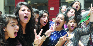 Students of Class XII celebrate their success after announcement of CBSE results in New Delhi on Thursday.