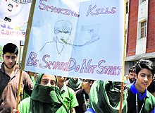Students take out a rally against drug abuse on World Anti-Tobacco Day in Srinagar on Thursday