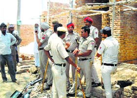 The police got the construction of a building stalled in Kallarkhera village after a clash