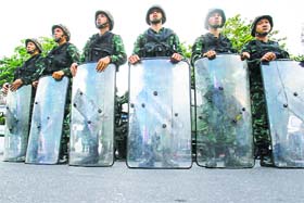 Soldiers guard the Victory Monument after it was banned to anti-coup protesters, in Bangkok on Thursday