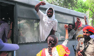 Family members of the rape victim being rounded up by the police in Bathinda on Friday.