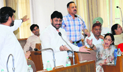 Newly elected MP Kirron Kher and Congress councillors argue over an issue during a meeting of the MC in Chandigarh on Friday. 