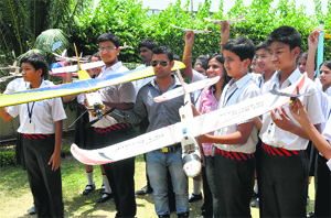 Students of Hallmark Public School pose with self-made Balsa Wood Chuck Gliders during an aero-modelling and aircraft designing workshop at Sector 15 in Panchkula on Friday.