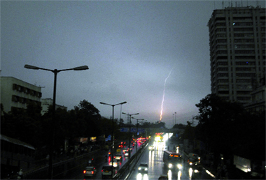 Dust storm fallowed by rain causes traffic chaos in New Delhi on Friday. 
