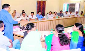 Mayor Manoj Garg and ward councillors discussing installation of LED lights in the civic body periphery in all 30 wards at the Town Hall in Haridwar on Friday