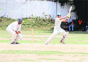 A batsman plays a shot in a match in the All India Uttarakhand Gold Cup Cricket Tournament in Dehradun on Friday