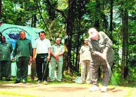 MASTERSTROKE: Governor Aziz Qureshi tees-off at the inauguration of the 12th Governors Cup Golf Tournament at the golf course at Raj Bhavan in Nainital on Friday