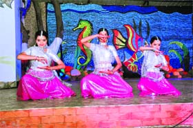 Colourful performance: Girls perform at a cultural programme Guldasta at the Doon Girls School in Dehradun on Friday