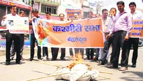 Agitators move: Members of the Kashmiri Sabha burn an effigy of Jammu and Kashmir Chief Minister Omar Abdullah in Dehradun on Friday