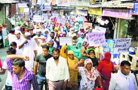 Furlak villagers block the NH-1 at Gharaunda in Karnal district on Friday, demanding the arrest of the rape accused