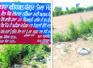 The police authorities had put up such signboards alongside roads leading to Daulewala village in Moga district; (and right) two cement blocks that stand testimony to their removal on Friday.