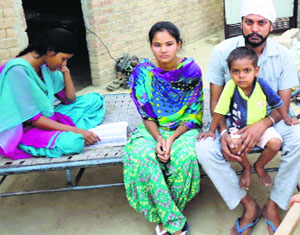 Rajvir Kaur and Harvir Kaur with their maternal uncle in their house at Muktsars Gandhar village on Friday.