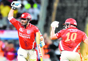 Sehwag punches the air after scoring a match-winning hundred against Chennai Super Kings in Mumbai on Friday.