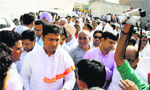 State Congress chief Ashok Tanwar meets party workers at the Congress Bhawan in Sirsa on Saturday. 