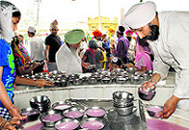 Sweet water being served to devotees