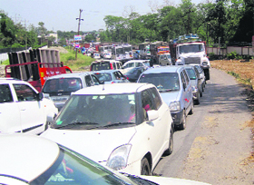 Vehicles stranded on the Dehradun-Haridwar highway at Harrawala near Dehradun on Sunday.