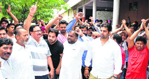 Residents and BJP workers hold protest outside the Police Commissioners office against the lathicharge by police in which several persons sustained injuries in Jalandhar on Sunday
