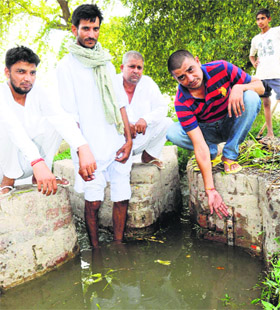 Khanpur residents show poor water level in the distributary reaching the village.