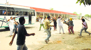 Supporters of an Akali transporter and PRTC staff clash at the Faridkot bus stand on Sunday.