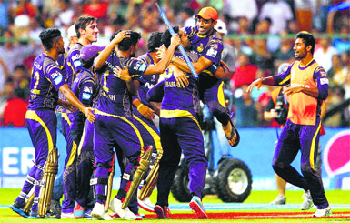 The Kolkata Knight Riders players go berserk with joy after beating Kings XI Punjab to win the IPL-7, their second title, in Bangalore on Sunday.