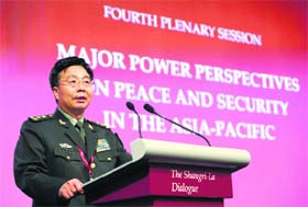 Deputy chief of staff of the Chinese Army, Lieutenant-General Wang Guanzhong, speaks during a plenary session at the 13th Asia Security Summit in Singapore on Sunday