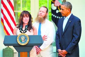 Jani Bergdahl, the mother of freed US soldier Bowe Bergdahl, speaks to the press while her husband Bob Bergdahl and US President Barack Obama look on at the White House
