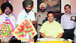 Employees welcome the new MC Commissioner, Pradeep Sabharwal, at his office in Amritsar on Monday