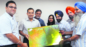 New DC of Bathinda Dr Basant Garg (left), accompanied by other officials, presents a memento to the outgoing DC Kamal Kishore Yadav.
