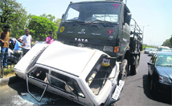 The car that was damaged after being hit by an Army vehicle at the Housing Board light point in Mani Majra on Monday.