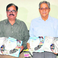 Upkar Krishan Sharma (right), president of the GGDSD College Society, and principal Bhushan K Sharma release the prospectus on the college premises, Sector 32, on Monday.
