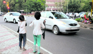 Child beggars at Sector 22/21 light point on Monday evening.