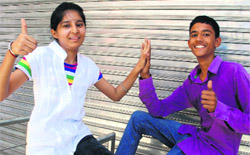 Meenakshi, who has  topped Mohali district by scoring 93.69 per cent marks in the PSEB Class X exams, and Khushdeep, the second topper of the district with 93.38 per cent marks, celebrate their success in Dera Bassi on Monday.