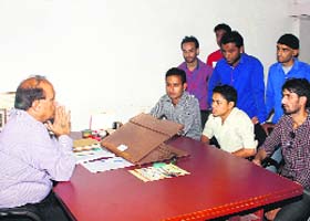 Students meet principal Devender Bhasin in Dehradun on Monday
