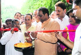 Dehradun Mayor Vinod Chamoli inaugurates the new online tax paying system at Dehradun Municipal Corporation office in Dehradun on Monday