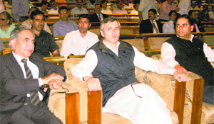 Chief Minister Omar Abdullah with Power Minister Vikar Rasool (R) and Agriculture Minister Ghulam Hassan Mir (L) during the launching ceremony of the Restructured Accelerated Power Development and Reforms Programme in Srinagar on Monday.I