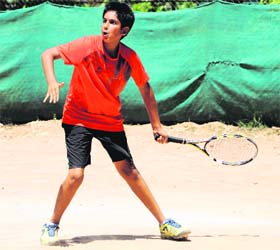 A player in action during a tennis tournament at the YMCA courts, Sector 11, Chandigarh, on Tuesday