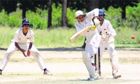 Players in action during a match of the Ist Usha Memorial Cricket Cup at Sector 56, Chandigarh, on Tuesday