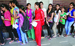 Students in a queue to collect the admission form at Daulat Ram College, North Campus, on the second day of admission process in Delhi University on Tuesday
