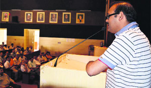 Alok Kumar Pandey, Assistant District Election Officer, addresses election officials undergoing training for panchayat poll in Dehradun on Tuesday.