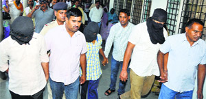 The CIA staff take the accused to a court in Karnal on Tuesday.
